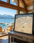 Wooden Stowe Vermont ski map overlooking a mountain lake in a luxury vacation home.