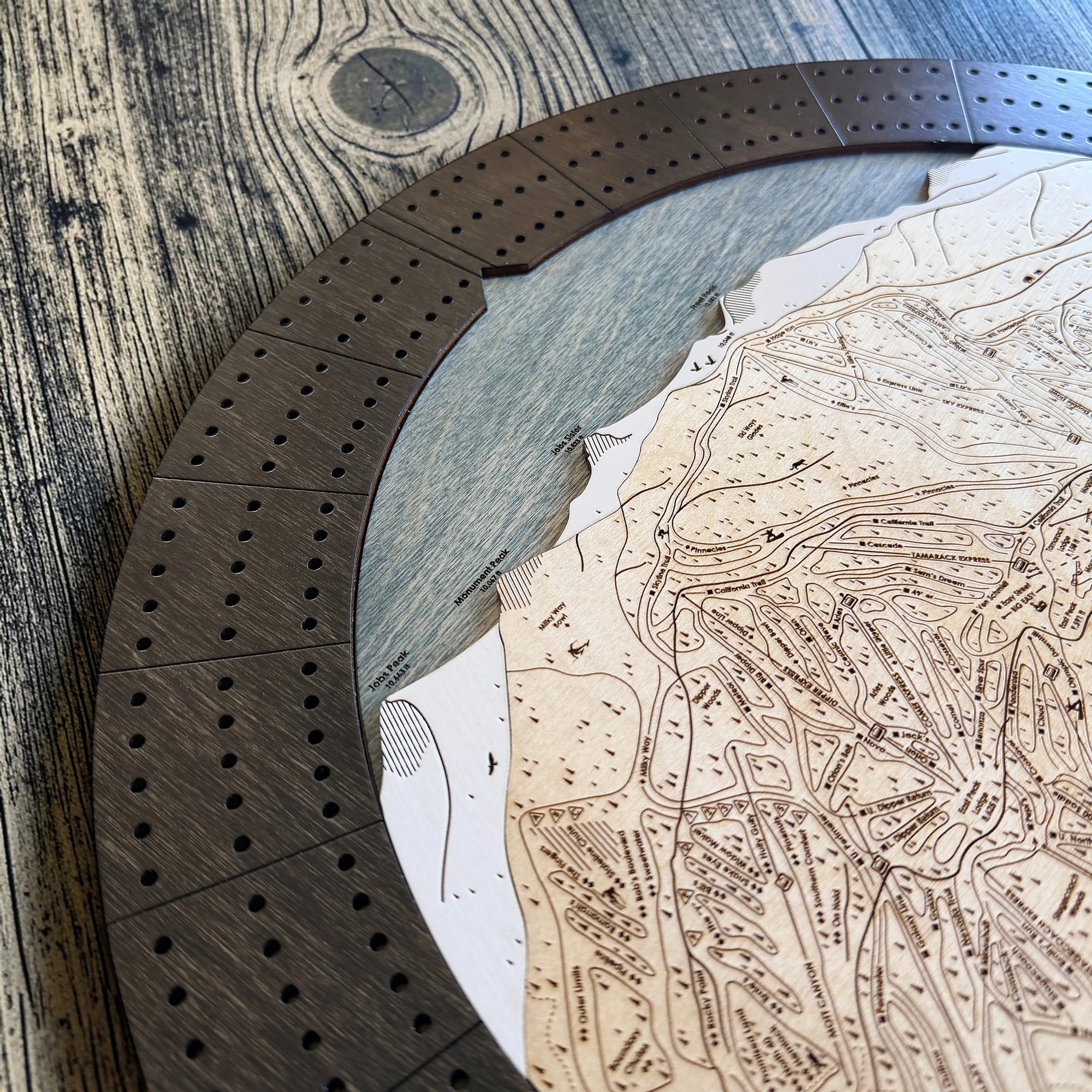 Close-up of the engraved ski trails and mountain terrain featured on the Heavenly Ski Map Cribbage Board.