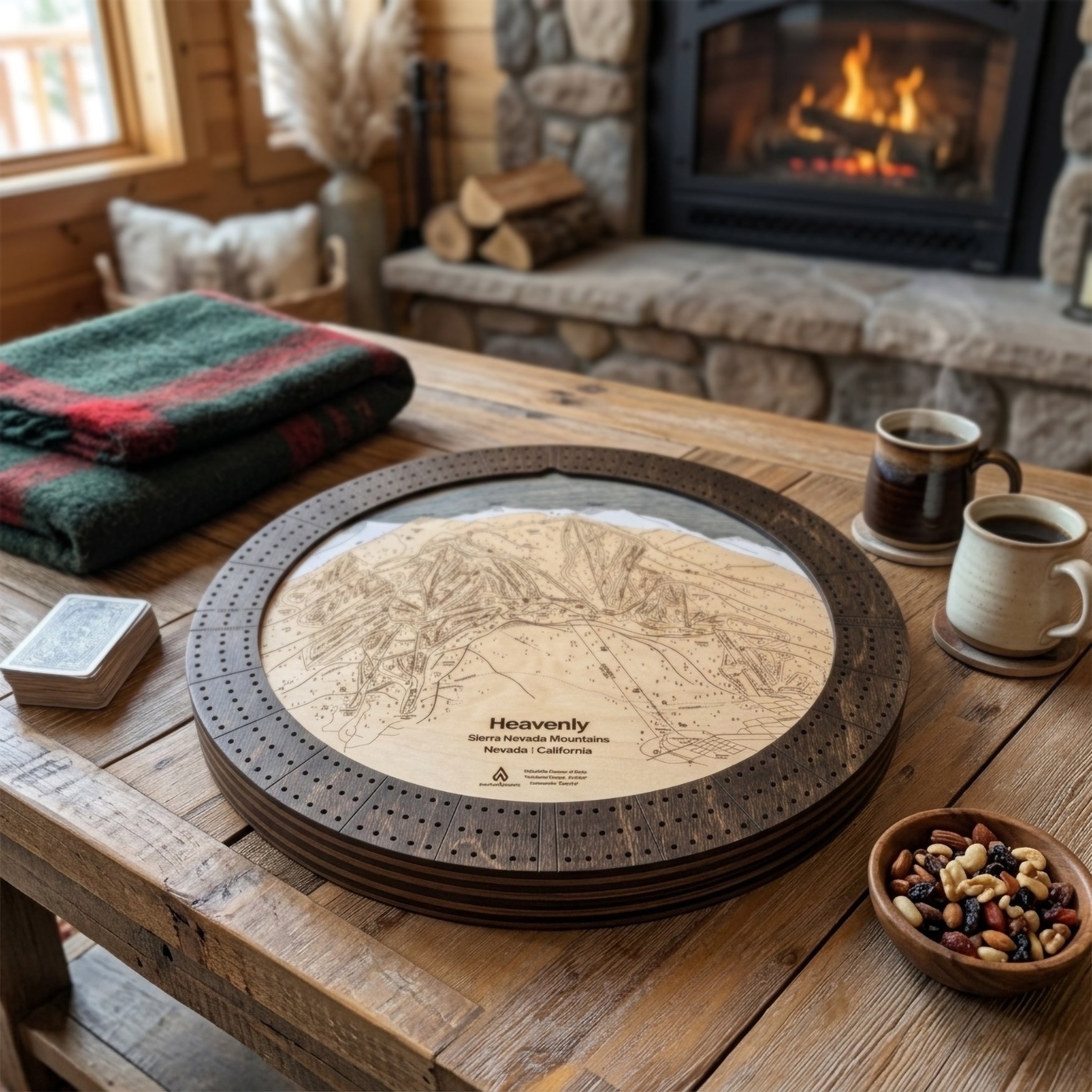 Heavenly Lake Tahoe wooden ski map cribbage board staged for game night in a cozy mountain cabin with coffee and fireplace.