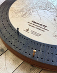 Close-up of the Heavenly Ski Map Cribbage Board with solid metal playing pegs, engraved ski trails, and layered wood construction.