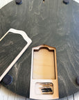 Hidden storage compartment inside the Heavenly Ski Map Cribbage Board designed to hold metal playing pegs and a deck of playing cards.