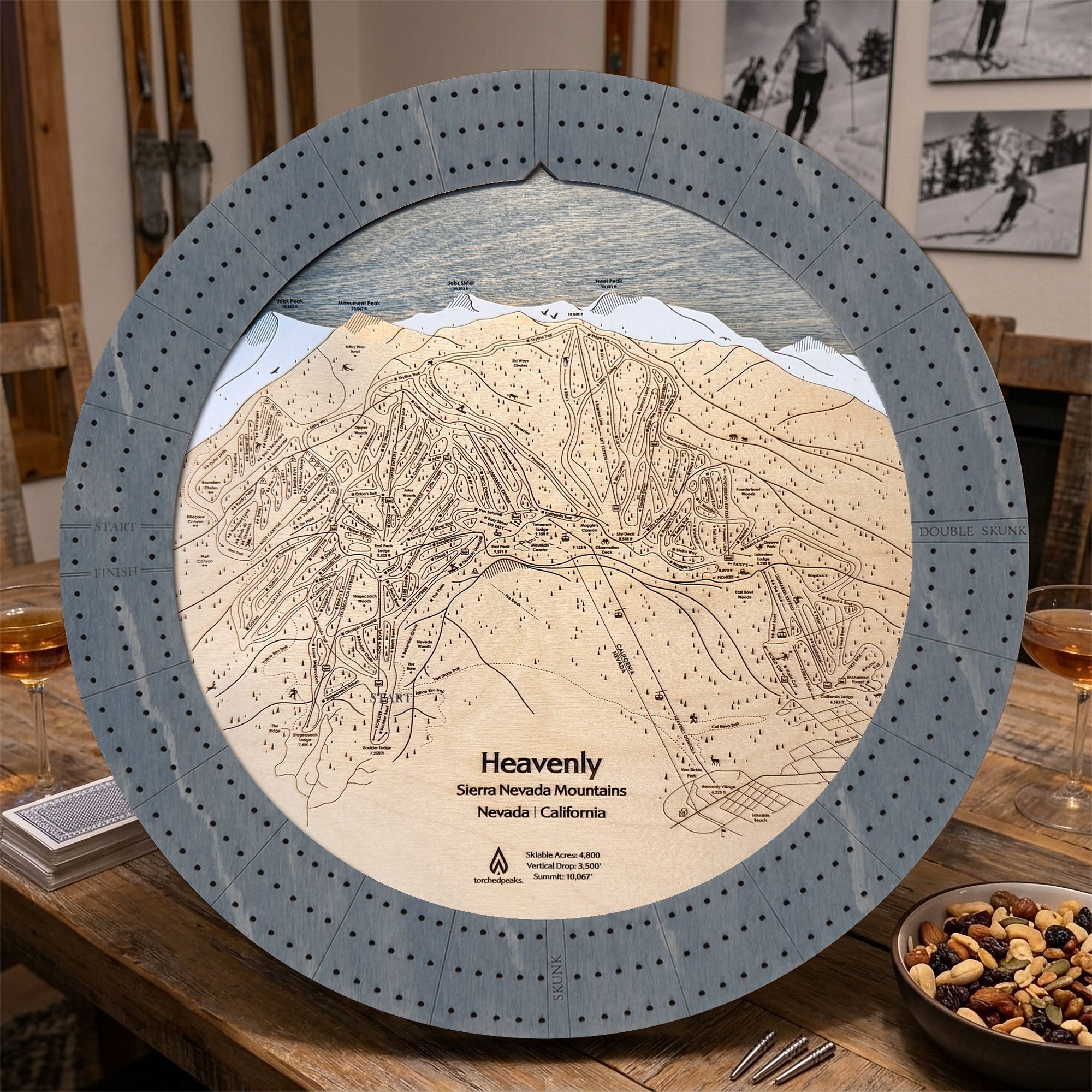 Heavenly ski map cribbage board showcased in an après-ski mountain home with fireplace and cabin furnishings