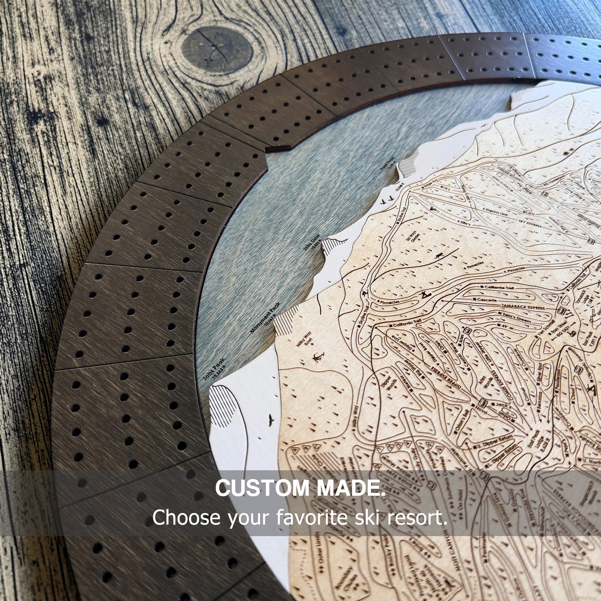 Custom wooden cribbage board with engraved ski trails, layered wood construction, and heirloom craftsmanship.