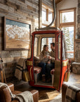 Handcrafted Lake Tahoe wood ski map displayed beside a vintage gondola in a luxury mountain ski cabin.