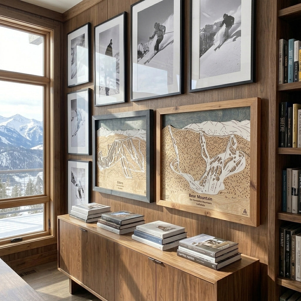 Handcrafted wood ski maps displayed in a luxury mountain home library alongside vintage ski photography and alpine views.