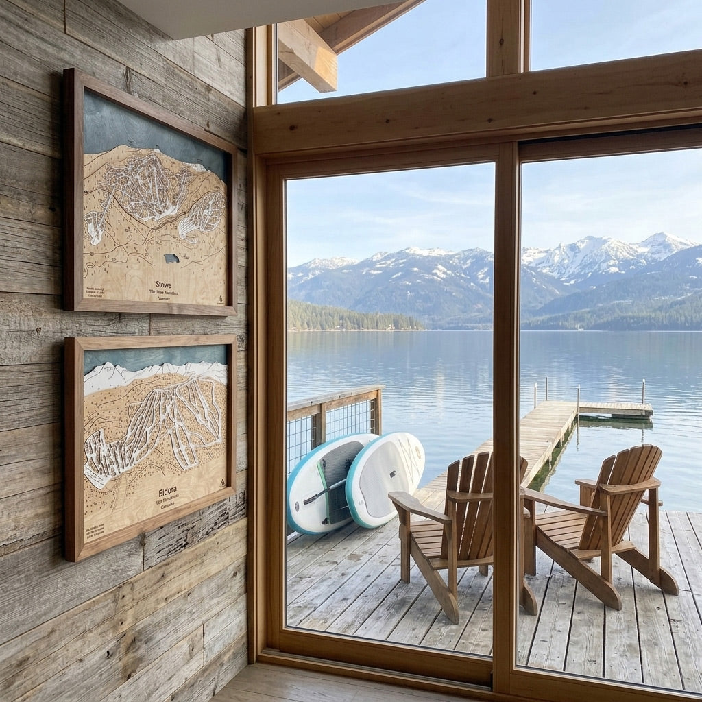 Handcrafted wood ski maps displayed in a luxury lakefront mountain home overlooking a private dock and alpine views